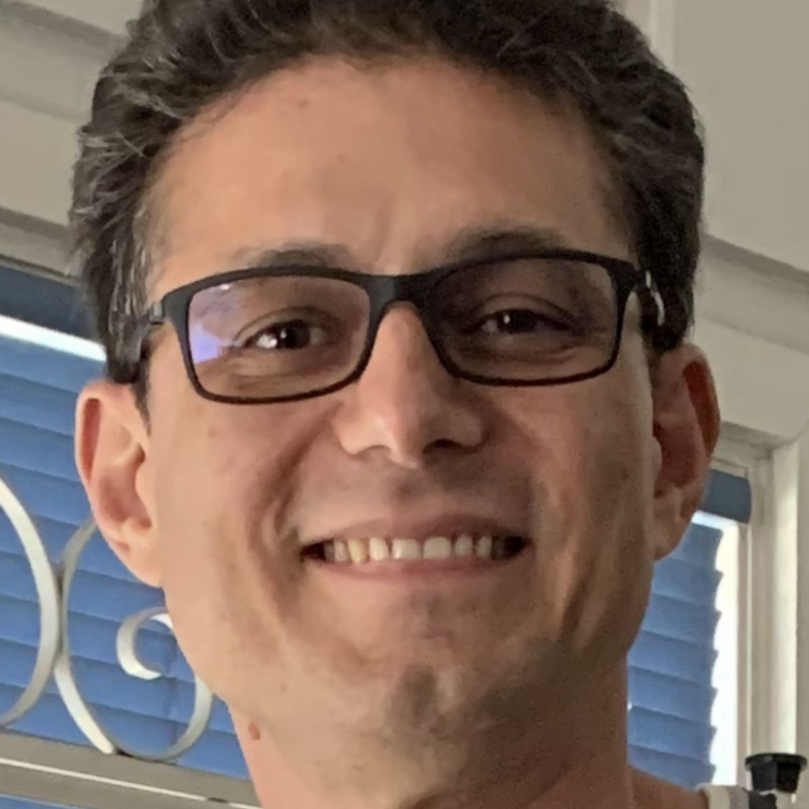 Profile of John Simon